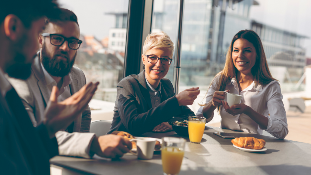 group of men and women networking over a business brunch